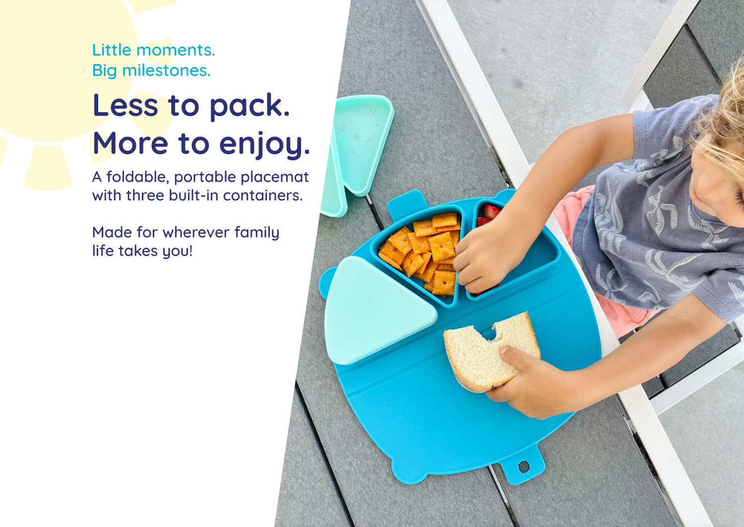 Toddler boy eating outside with an On-the-Go Snack Mat