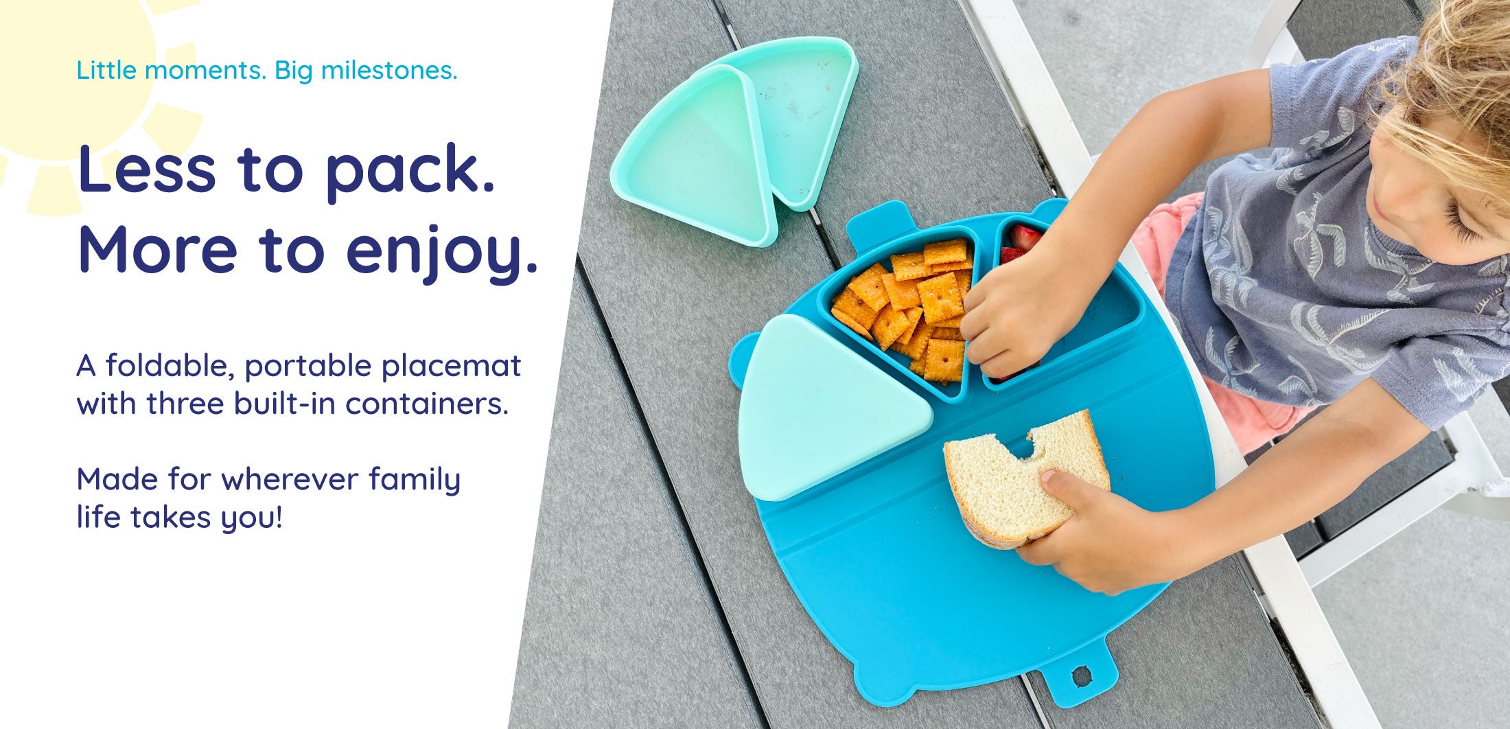Toddler boy eating outside with an On-the-Go Snack Mat